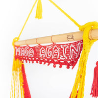 MAGA AGAIN red and gold swing chair with sign